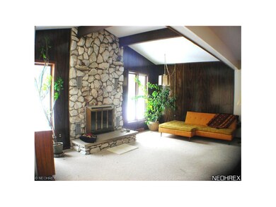 in this beamed cathedral ceiling family room... wh