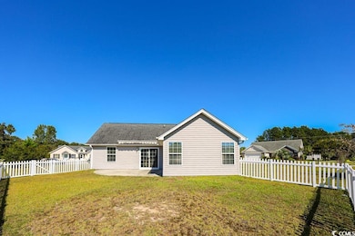 Rear view of property featuring a patio and a fenced backyard