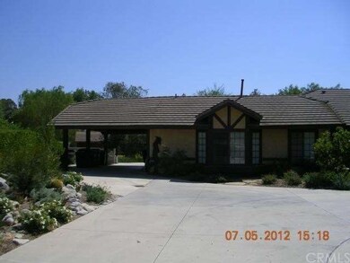 front shot of home with attached car port
