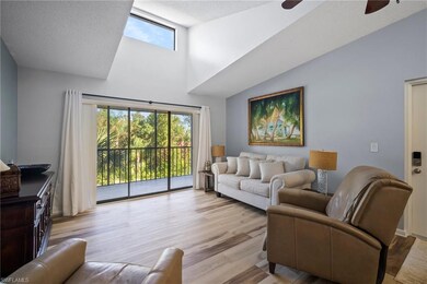 Living room featuring ceiling fan, a textured ceil