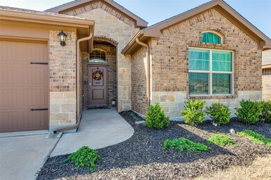Entrance to property featuring stone siding and br