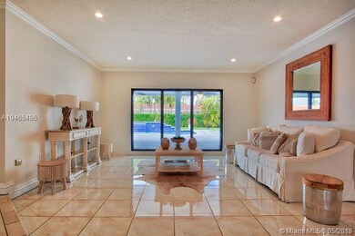 Formal living room just beyond foyer with view to 
