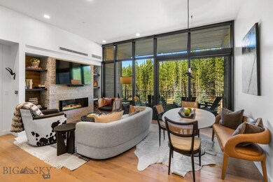 Living room featuring floor to ceiling windows, a
