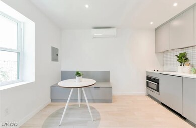 Kitchen with oven, a wall mounted air conditioner,