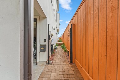 This is a side entryway to a modern home, featurin
