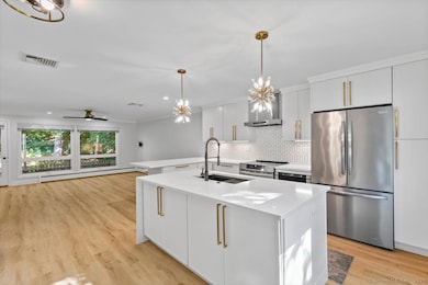 Remodeled kitchen with island and breakfast bar