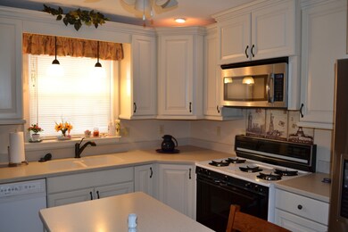 Gas range - sink overlooks yard