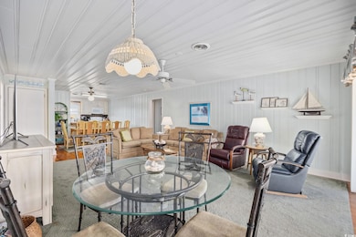 Dining room featuring visible vents and ceiling fa
