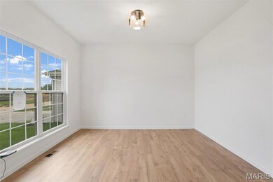 Empty room featuring light wood-style flooring and baseboards