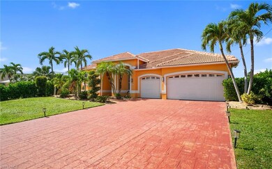 Mediterranean / spanish home featuring a front lawn, an attached garage, stucco siding, and a tiled roof