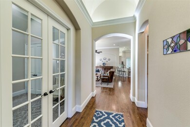 Entry-way with vaulted ceilings and crown molding.