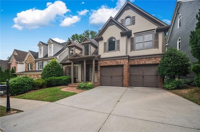 View of front of home with concrete driveway, a garage, and stone siding