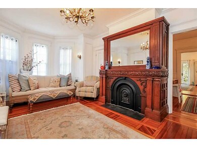 Living Room. Large and sunny front parlor with orn