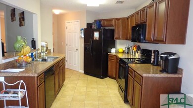 Roomy kitchen ready for the season. Eat in area ov