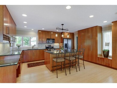 Stunning kitchen featuring large center island to 