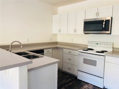 Kitchen has new stainless dishwasher and microwave