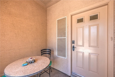 Property entrance with stucco siding