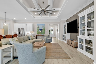 Living room featuring ornamental molding, ceiling 