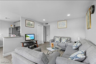 Living room with light tile patterned floors