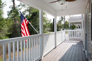 Wooden deck featuring ceiling fan