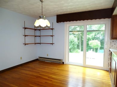 Family size dining room with sliders to the deck &