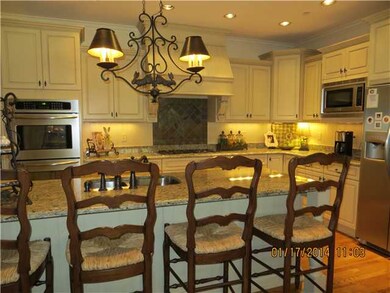 Very open kitchen with breakfast bar which seats f