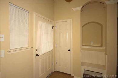 Entry shows coat closet, niech and bench .