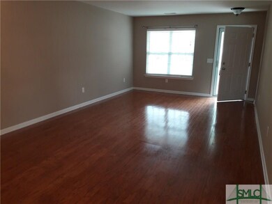 living/dining combo with hardwood floors