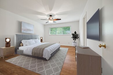 1st floor primary bedroom, virtually staged.
