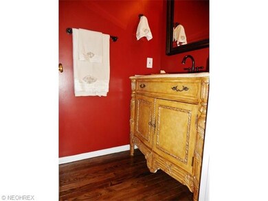 Guest bath with continued hardwood floors, detaile