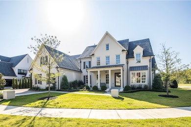 View of front facade with a front lawn and covered porch