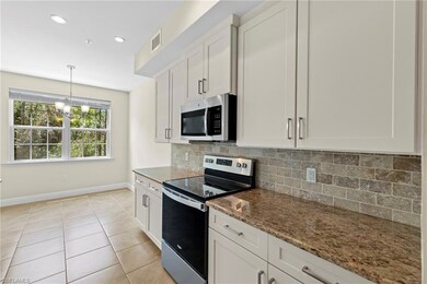 Kitchen featuring stainless steel appliances, desi