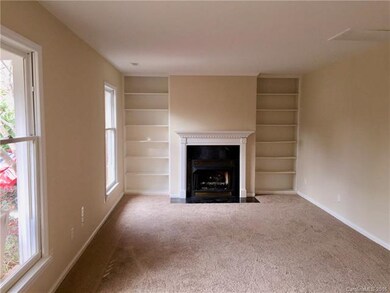 Living Room With Built-ins and Fireplace