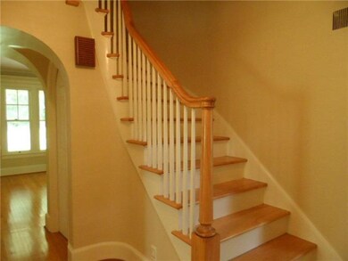 Foyer Enter foyer with gracious curved staircase, 