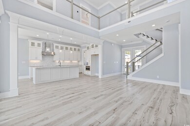 Unfurnished living room featuring visible vents, b