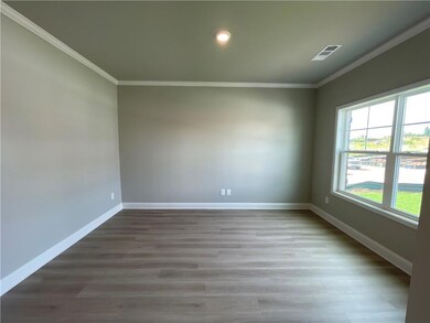 Empty room featuring hardwood / wood-style floors 