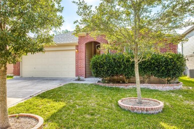View of front of house featuring brick siding, a 