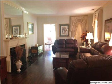 Formal living room that adjoins the sunroom.