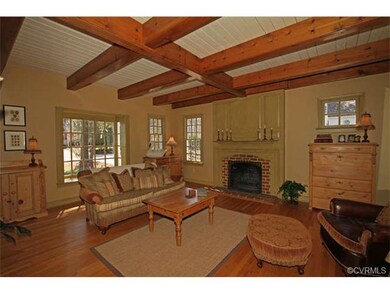 Gorgeous mantel and wood burning fireplace make th