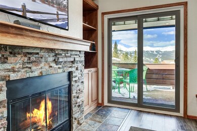 Entryway with a mountain view, a fireplace, and ba