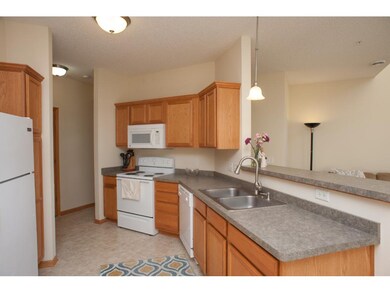 Kitchen overlooks dining and living room.