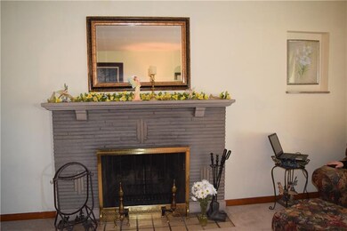 Beautiful stone log burning fireplace.