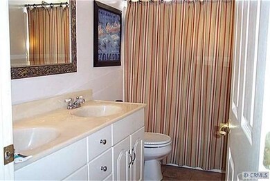 One of two Hall Bathrooms. Double Sink Vanity and 