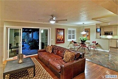 Gourmet kitchen opens to living and dining rooms