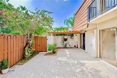 View of Front Entry with Patio and Privacy Fence