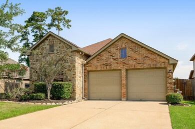 Beautiful brick and stone elevation with a 2-car garage, double-wide driveway, exterior LED uplighting and sprinkler system.