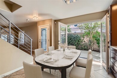 Dining space featuring stairs, light tile patterne