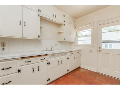 Kitchen with door to driveway