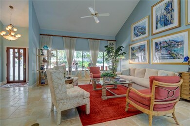 Entry foyer and living room with vaulted ceilings