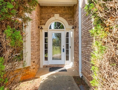 Entrance to property with brick siding